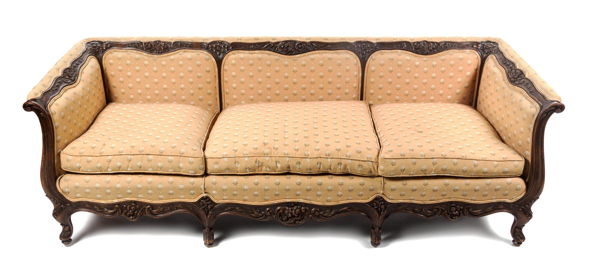 A Louis XV Style Carved Walnut Canape, Width 86 1/2 inches.