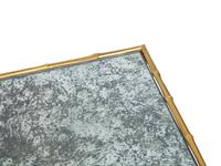 A Set of Three Gilt Metal Mirrored Nesting Tables in the Style of Maison Bagues