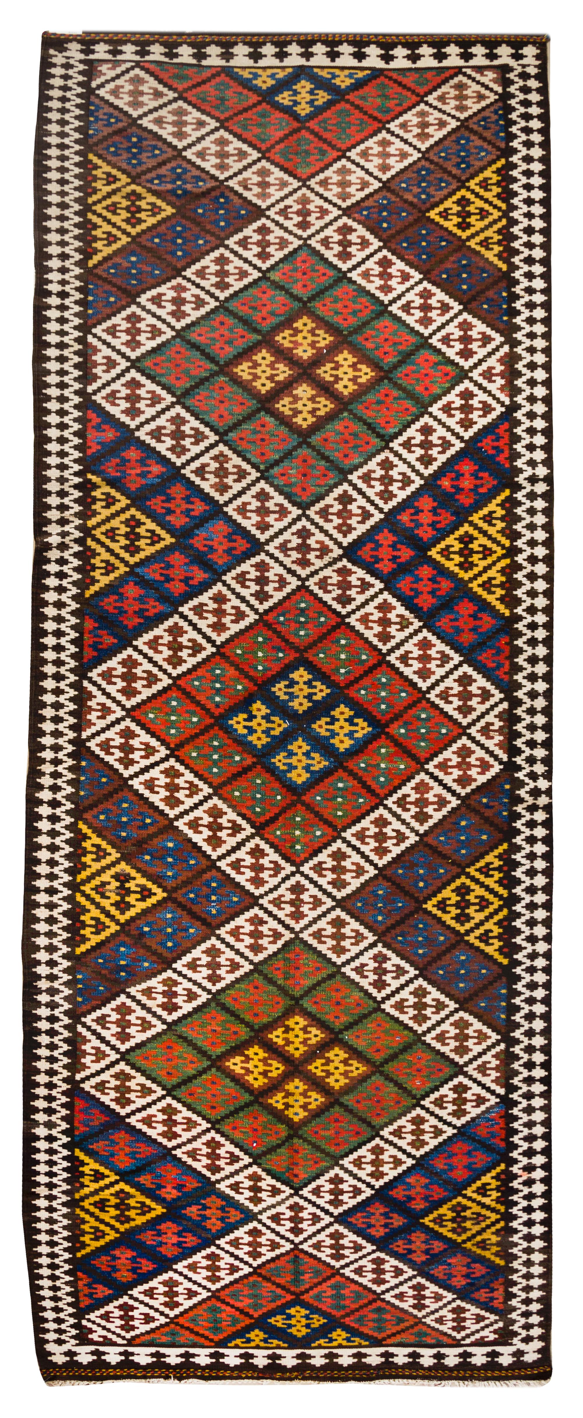 A Kilim Wool Rug 13 feet 2 inches x 4 feet 11 inches.