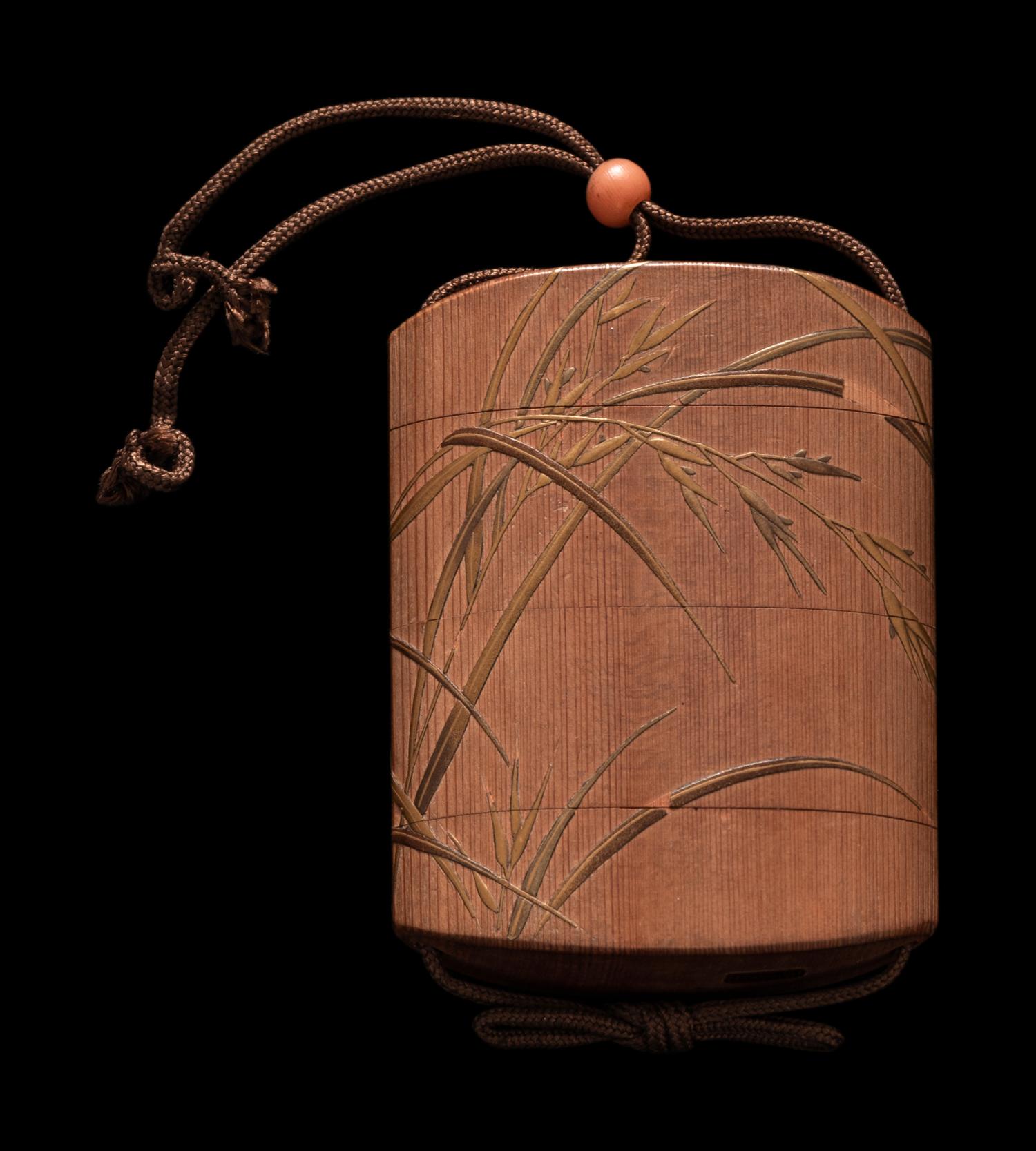 A Japanese Gold Decorated Wood Three-Case Inro