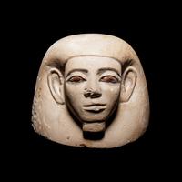 An Egyptian Stone Canopic Jar Lid