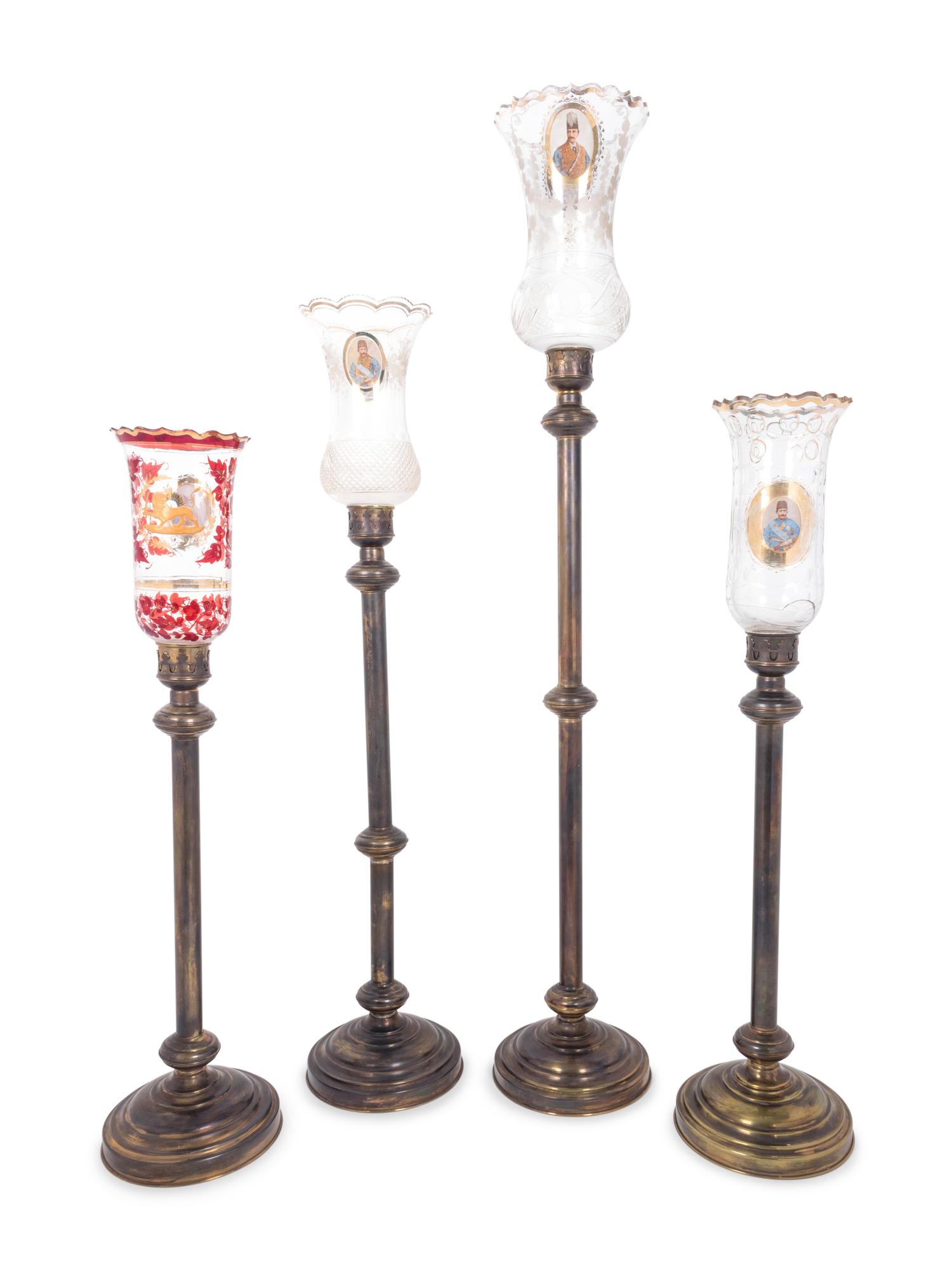 Four Brass and Enameled Glass Hurricane Candlesticks for the Persian Market