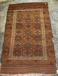 A Caucasian Wool Rug 4 feet 11 inches x 2 feet 10 inches. — EARLY 20TH CENTURY