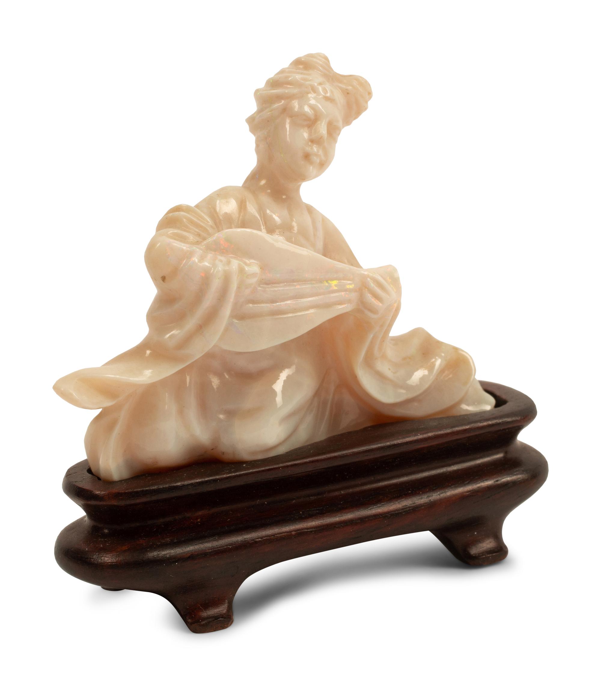 A Chinese Carved Opal Figure of a Musical Lady