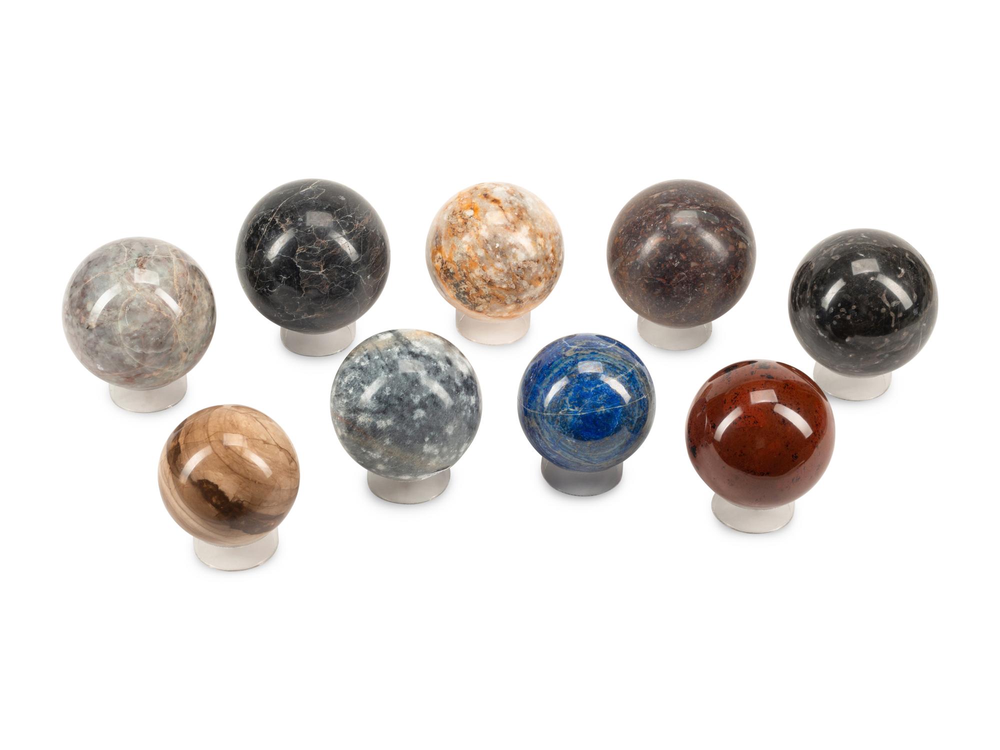 A Set of Nine Specimen Marble Spherical Ornaments