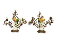 A Near Pair of French Porcelain, Gilt Bronze and Tole Lamps Mounted with Porcelain Parrots — LATE 19TH/EARLY 20TH CENTURY