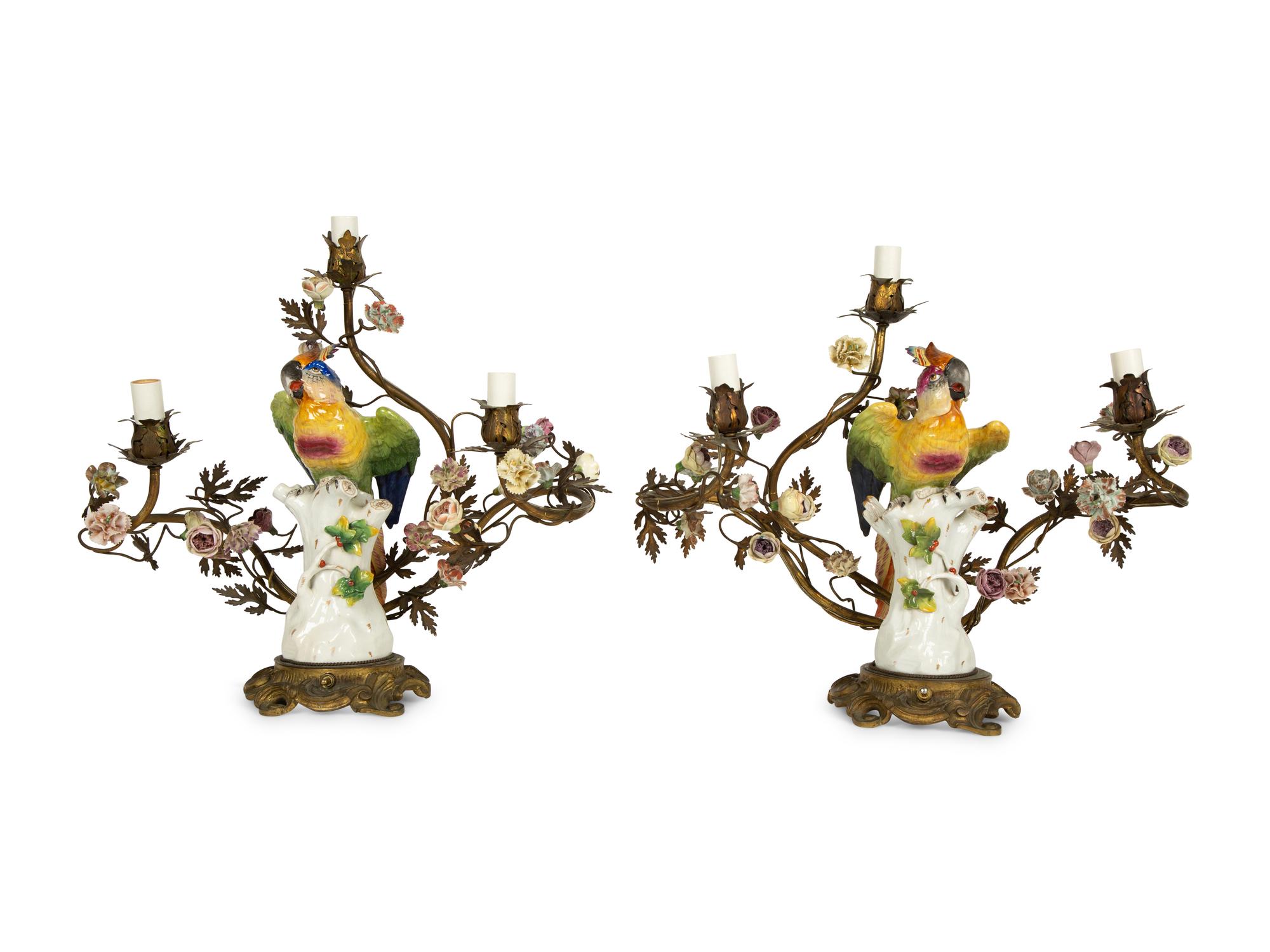 A Near Pair of French Porcelain, Gilt Bronze and Tole Lamps Mounted with Porcelain Parrots — LATE 19TH/EARLY 20TH CENTURY