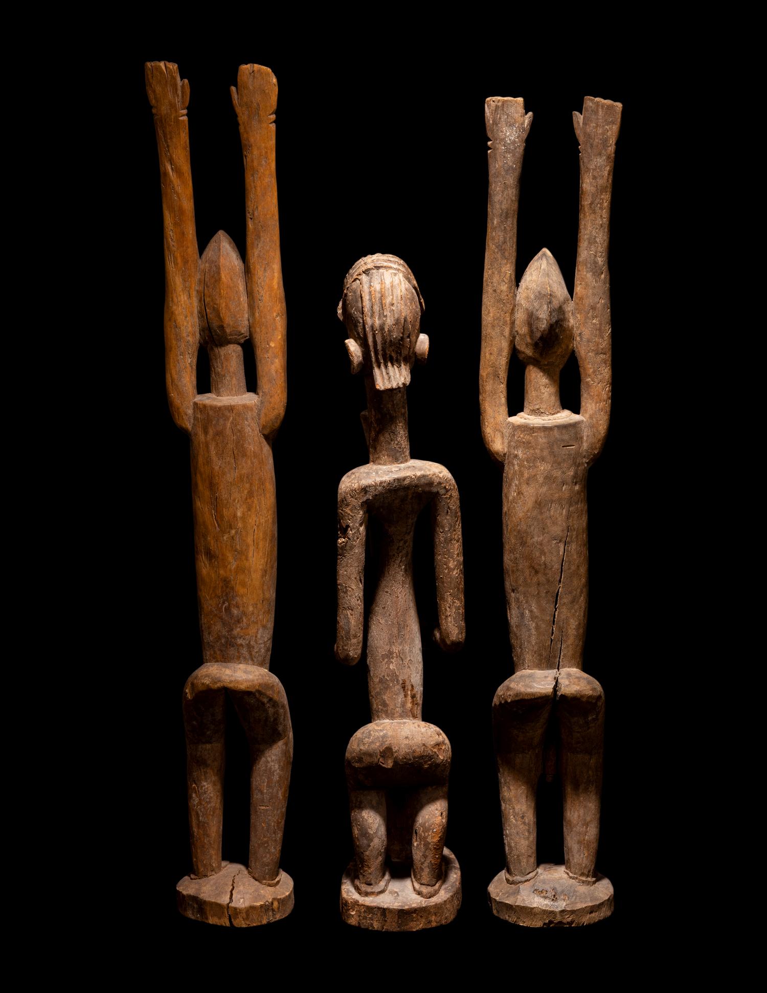 Three Dogan Wood Figures