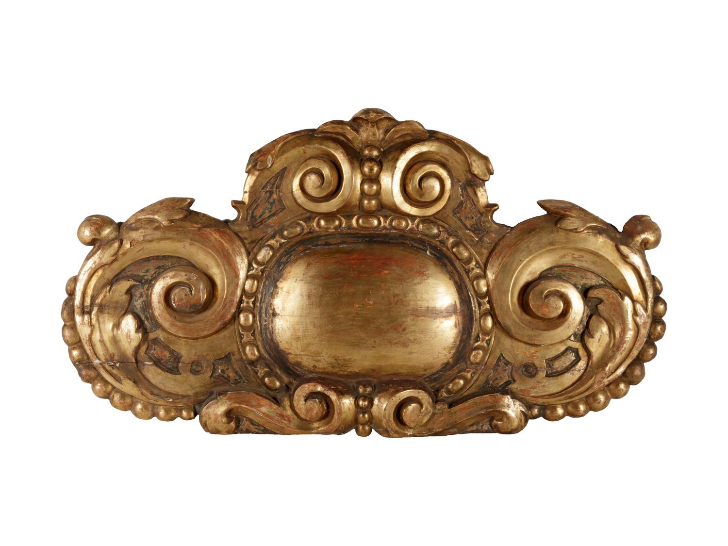 A Continental Carved Giltwood Ornament