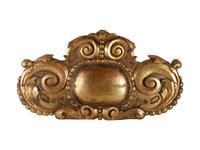 A Continental Carved Giltwood Ornament
