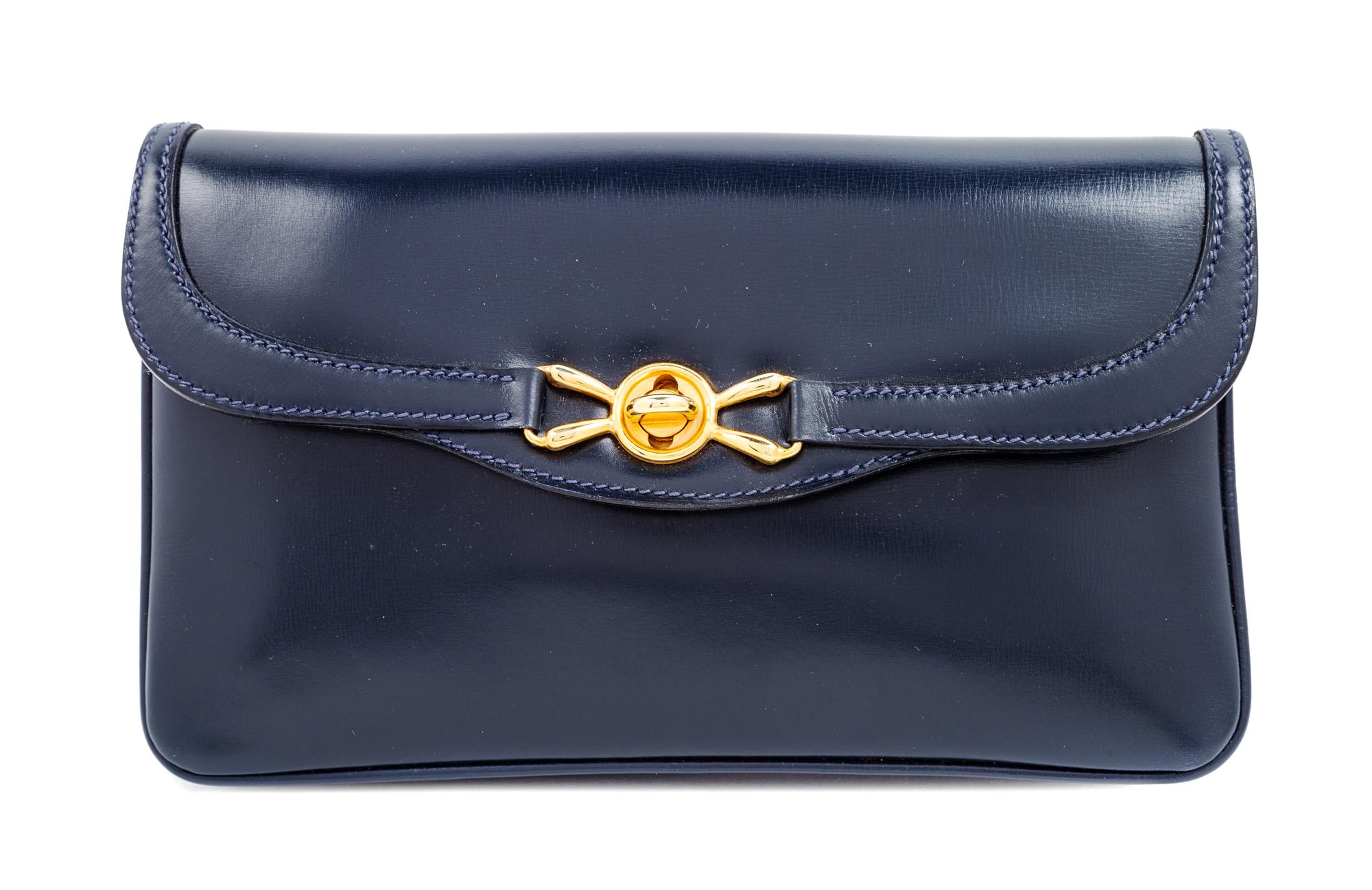 A Gucci Navy Leather Vintage Rectangular Clutch, 5.5" H x 10" W x 1" D.