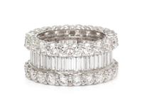An 18 Karat White Gold and Diamond Eternity Band, 6.50 dwts.