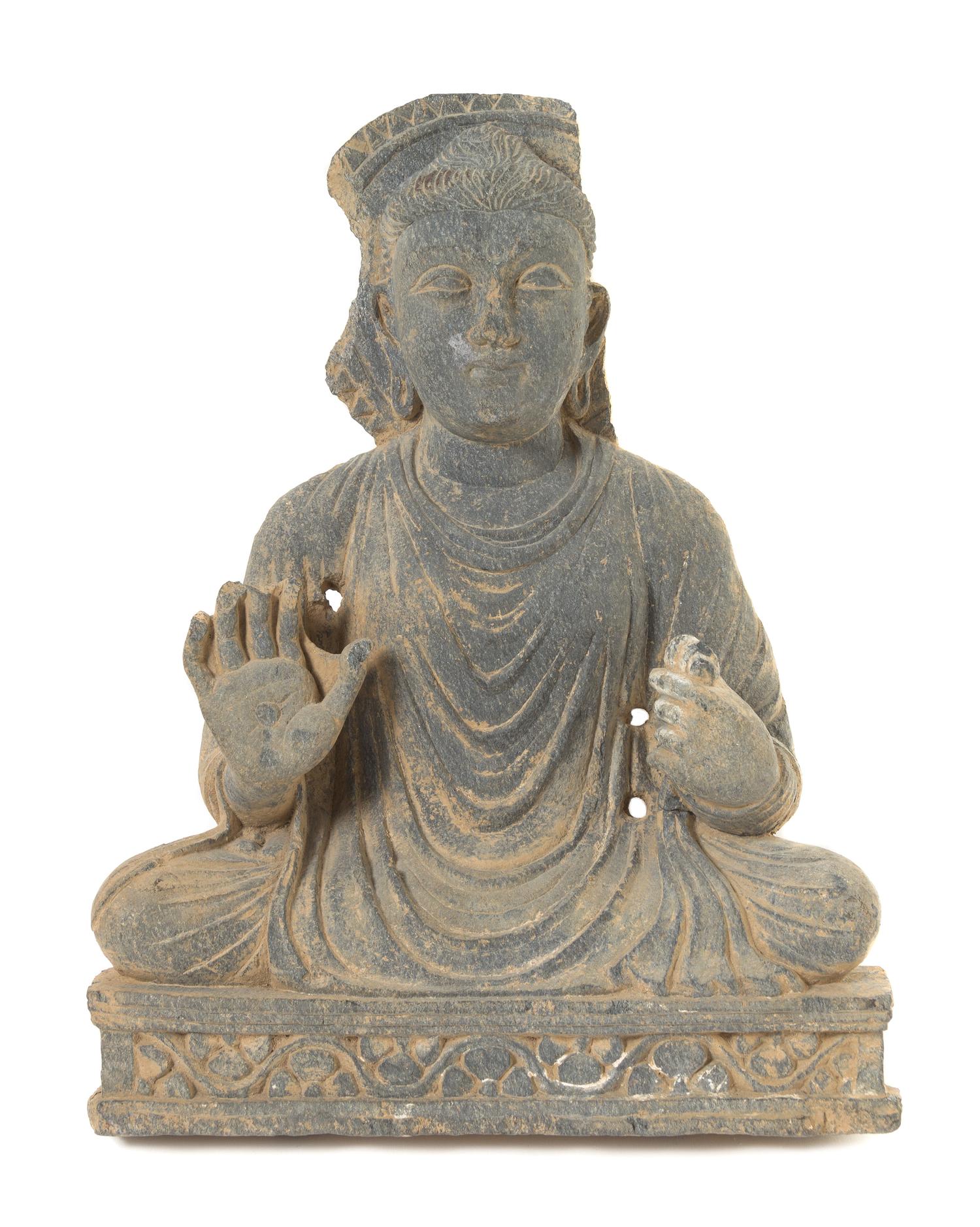 A Gandharan Schist Figure of a Seated Buddha Height 18 1/2 inches. — CIRCA 12TH-13TH CENTURY