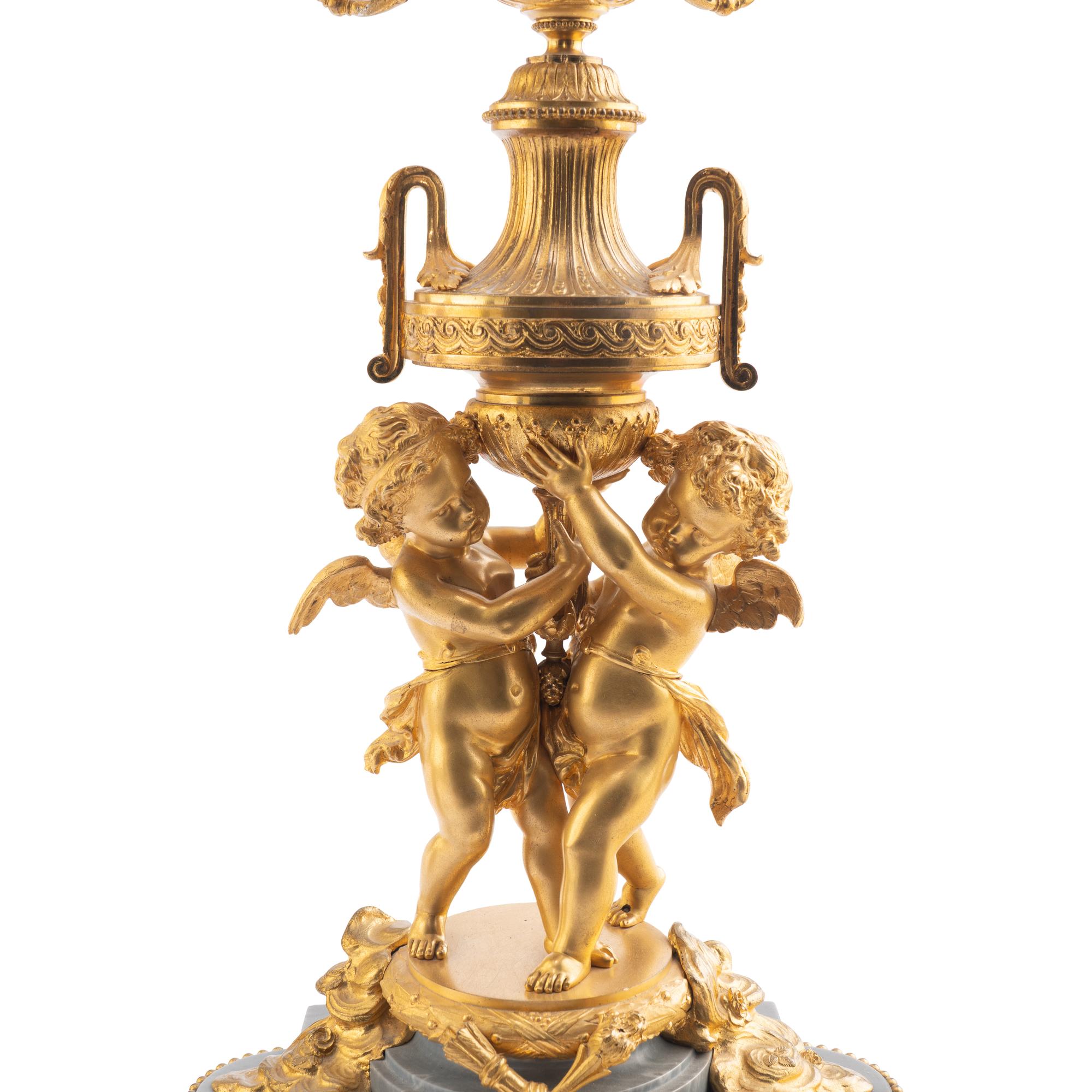 A Pair of Louis XV Style Gilt Bronze and Persian Grey Marble Six-Light Candelabra
