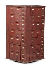 A Rotating Hardware Store Storage Cabinet in Red Paint