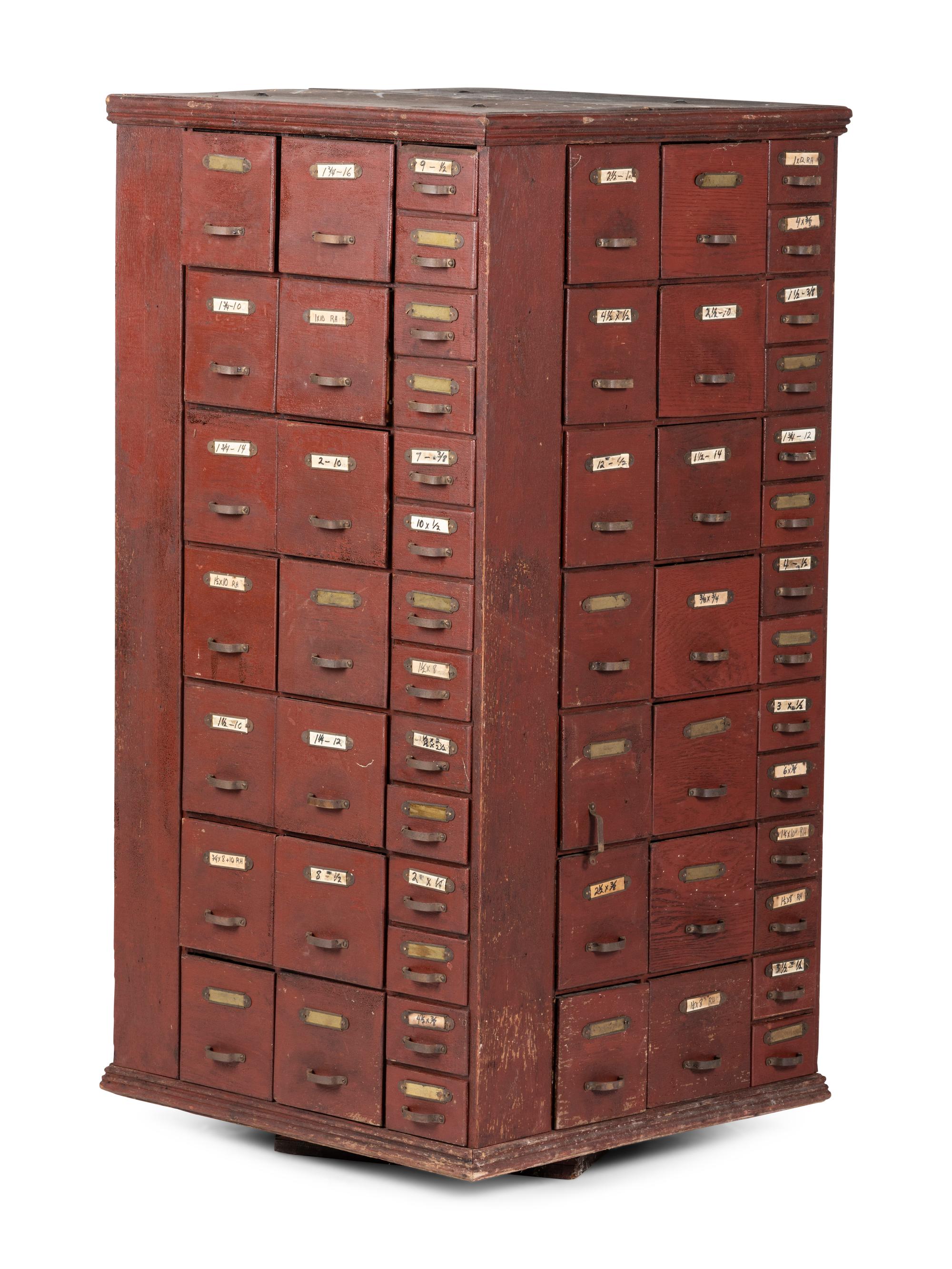A Rotating Hardware Store Storage Cabinet in Red Paint