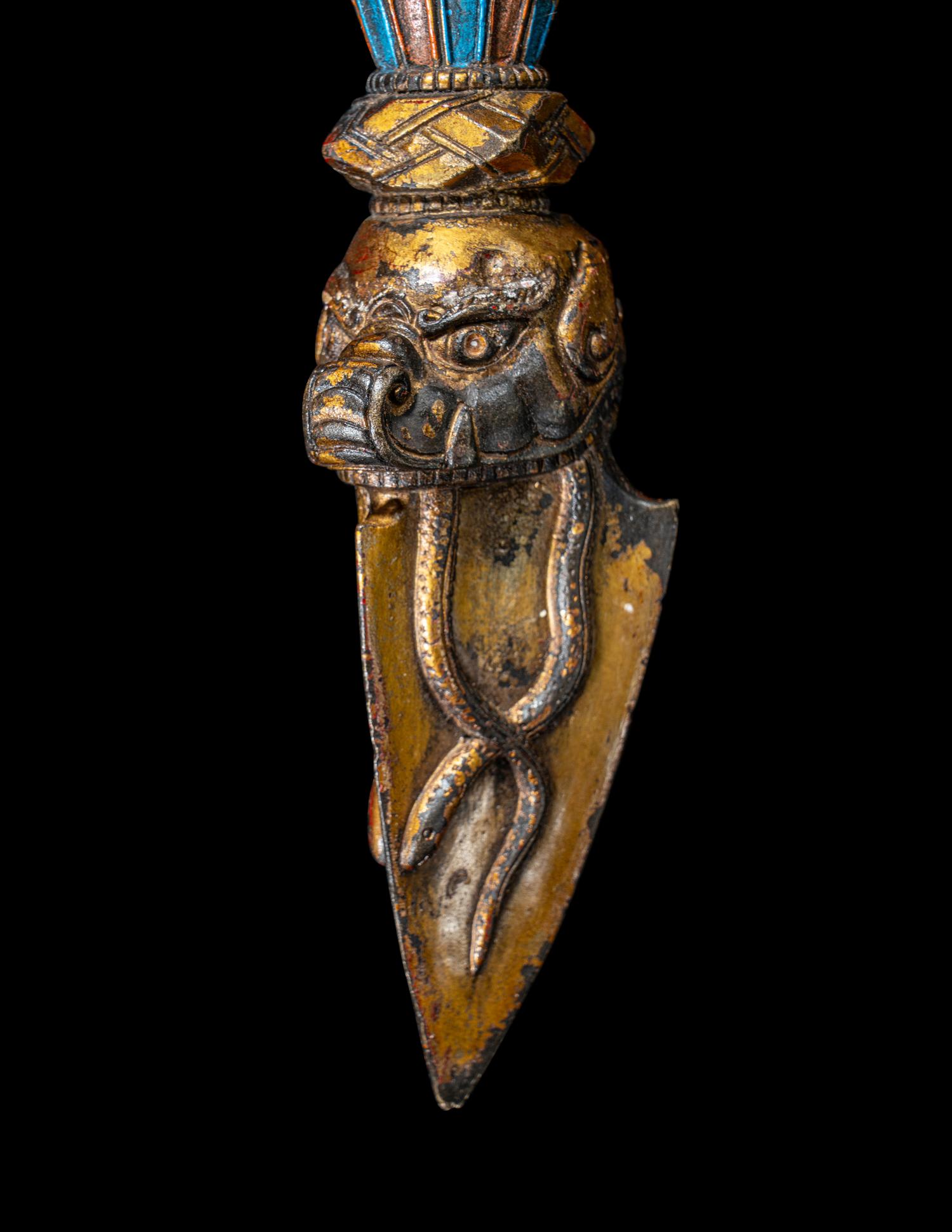 A Tibetan Gilt and Painted Bronze Vajra