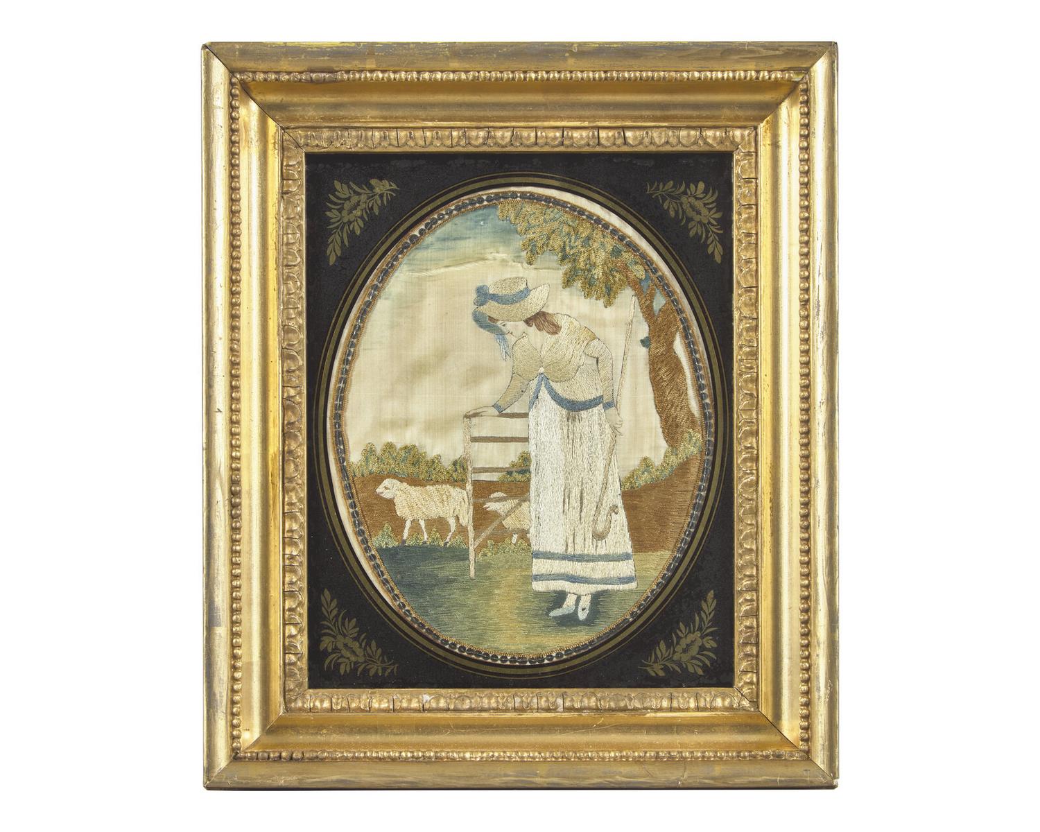 A George III Needlework Picture Depicting a Shepherdess with Sheep