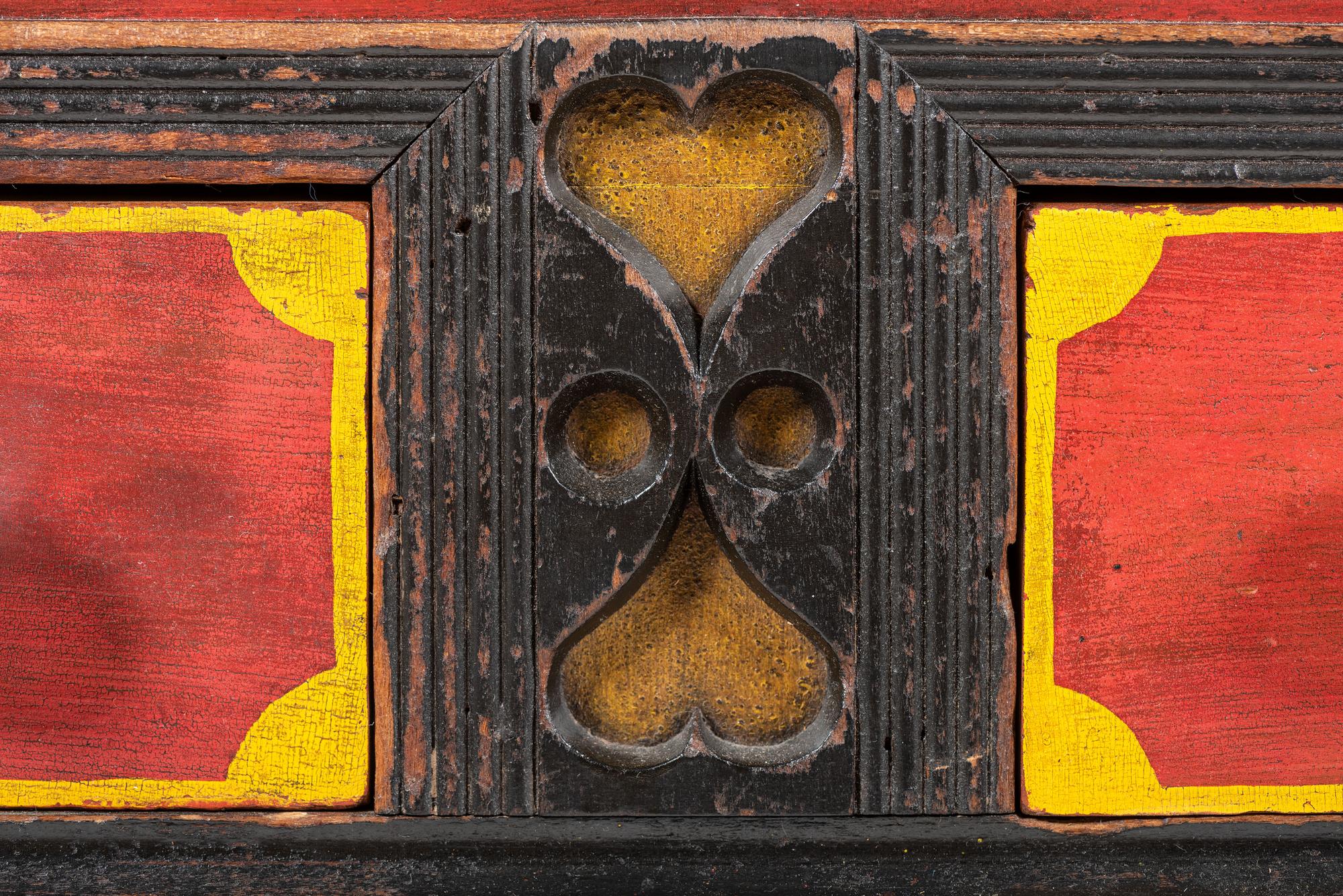 A Soap Hollow Stencil-Decorated and Heart-Carved Poplar Two-Drawer Blanket Chest