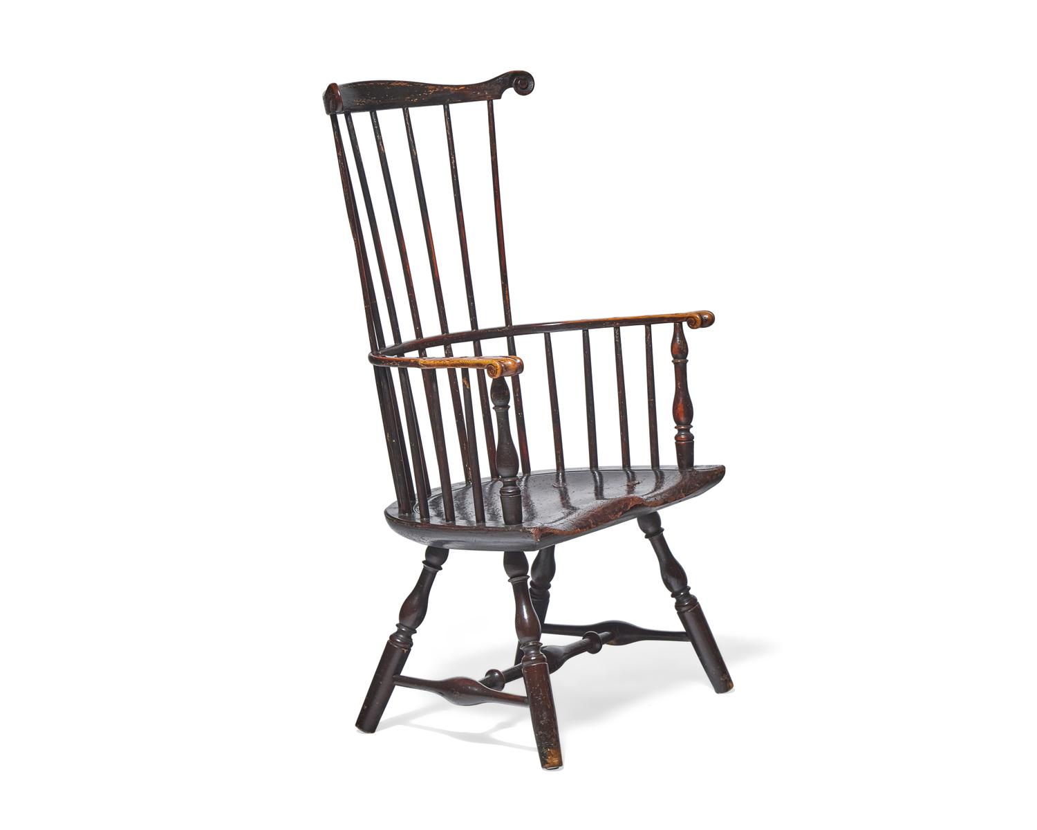 A Turned and Black-Painted Comb-Back Windsor Armchair