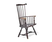 A Turned and Black-Painted Comb-Back Windsor Armchair