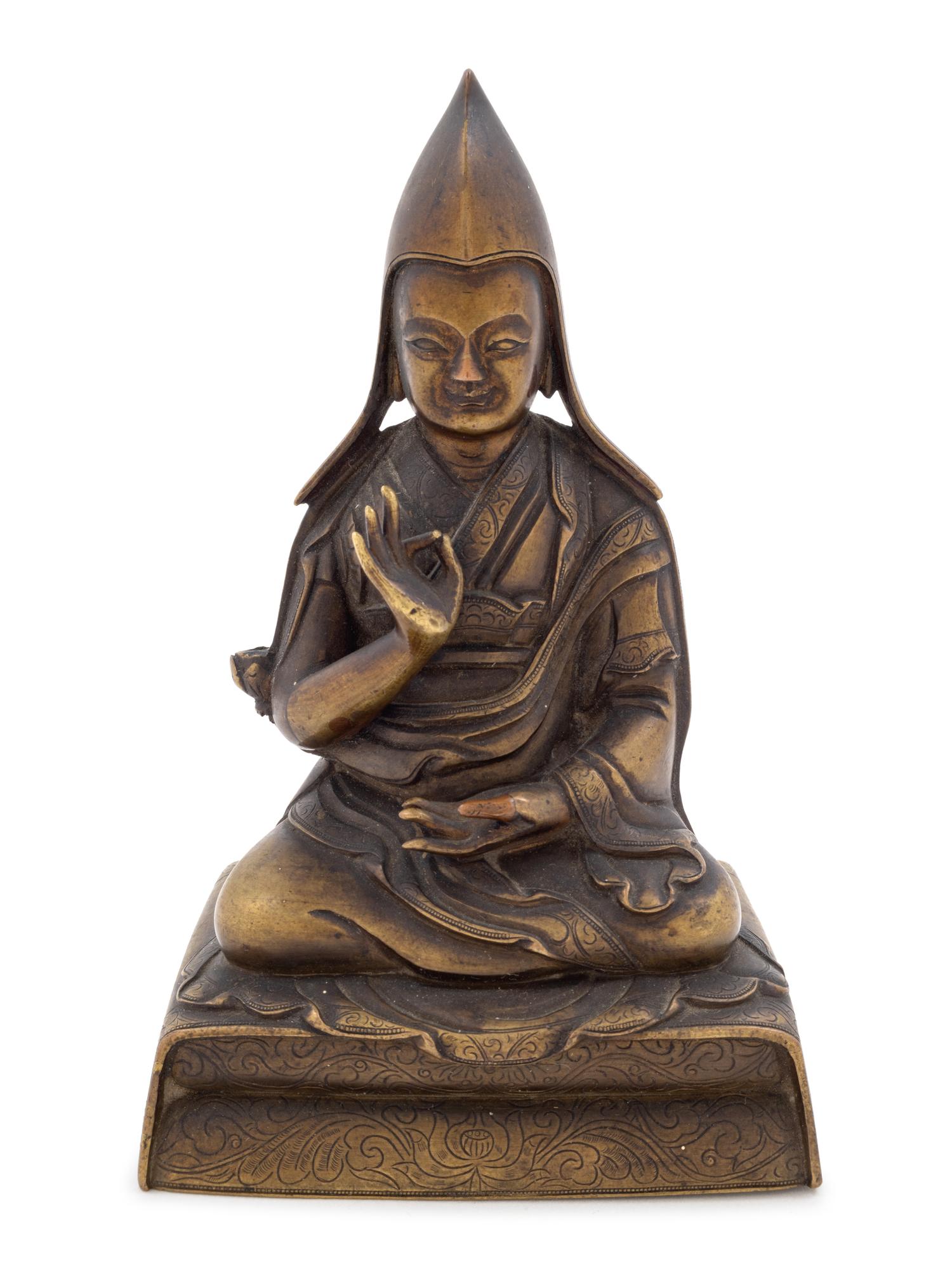 A Sino-Tibetan Gilt Bronze Figure of a Lama