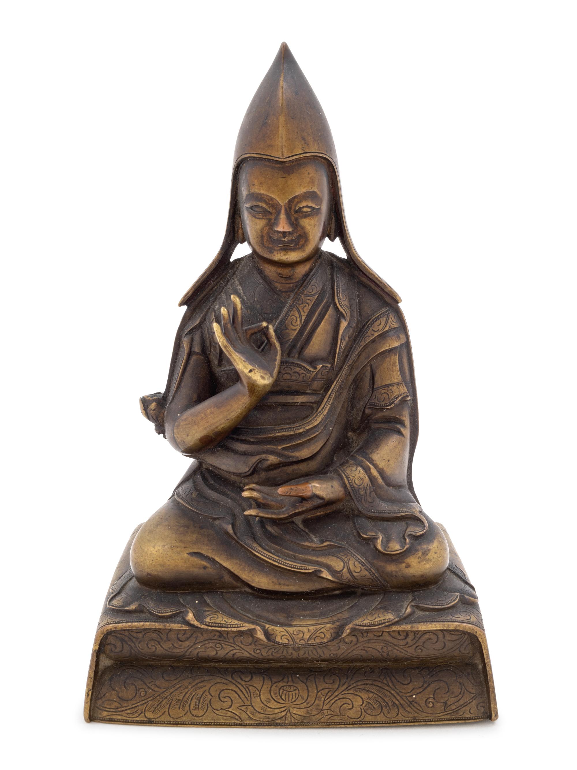 A Sino-Tibetan Gilt Bronze Figure of a Lama