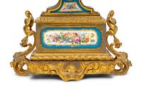 A French Gilt Metal and Porcelain Clock