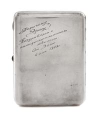 A Russian Silver Cigarette Case, Soviet Artel mark OKhA, Moscow, early 20th century, the lid engraved with a Soviet hammer and sickle a