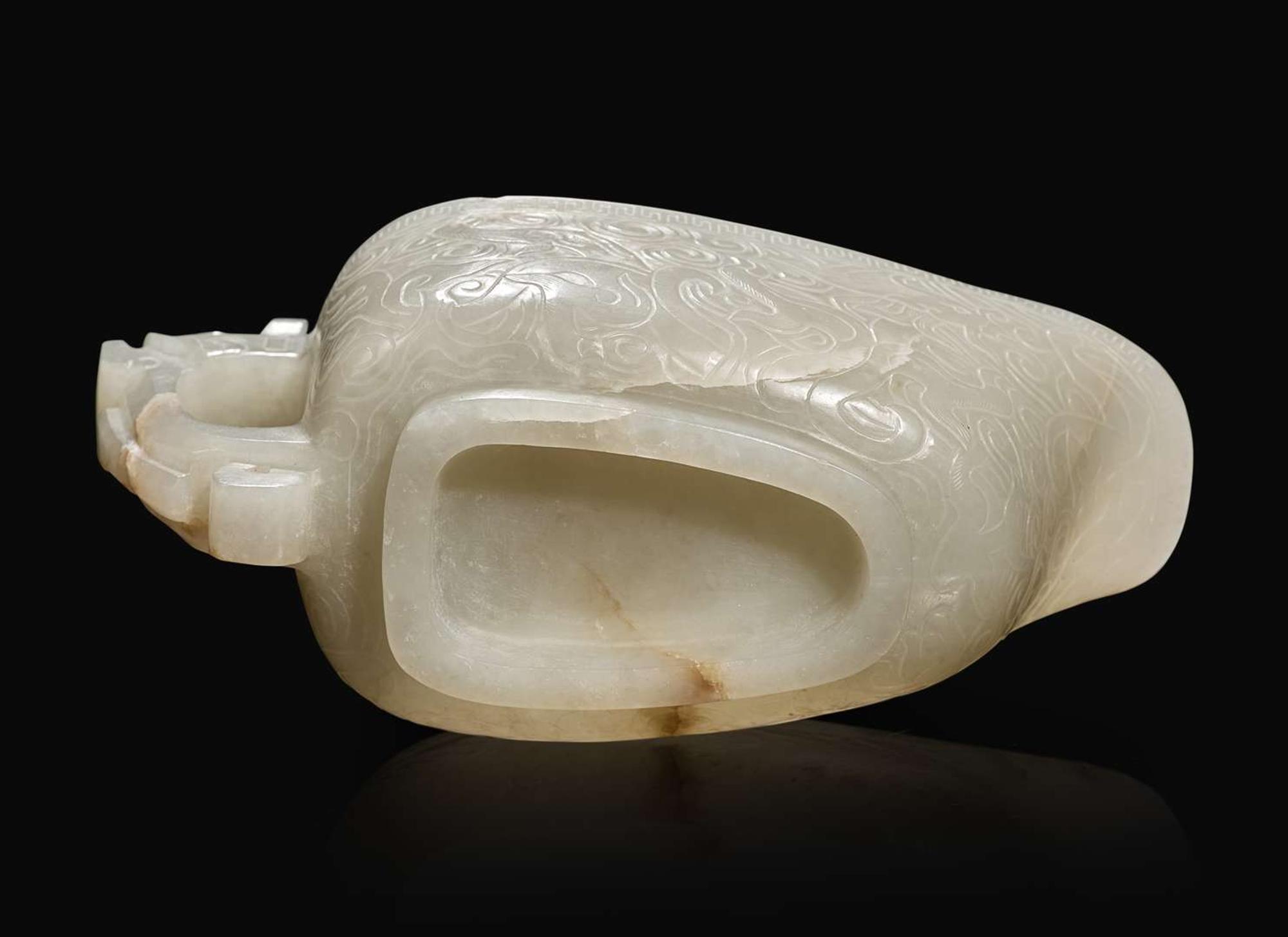 A Chinese carved white jade "Yi" water coupe, 18th/early 19th century or earlier 白玉水匜 十八至十九世紀或更早