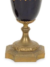 A Pair of Gilt Bronze Mounted Sevres Style Porcelain Urns