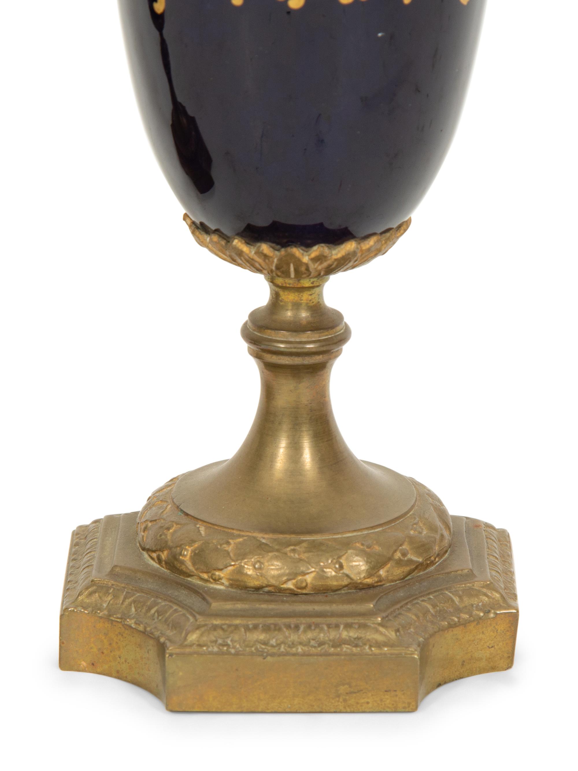 A Pair of Gilt Bronze Mounted Sevres Style Porcelain Urns