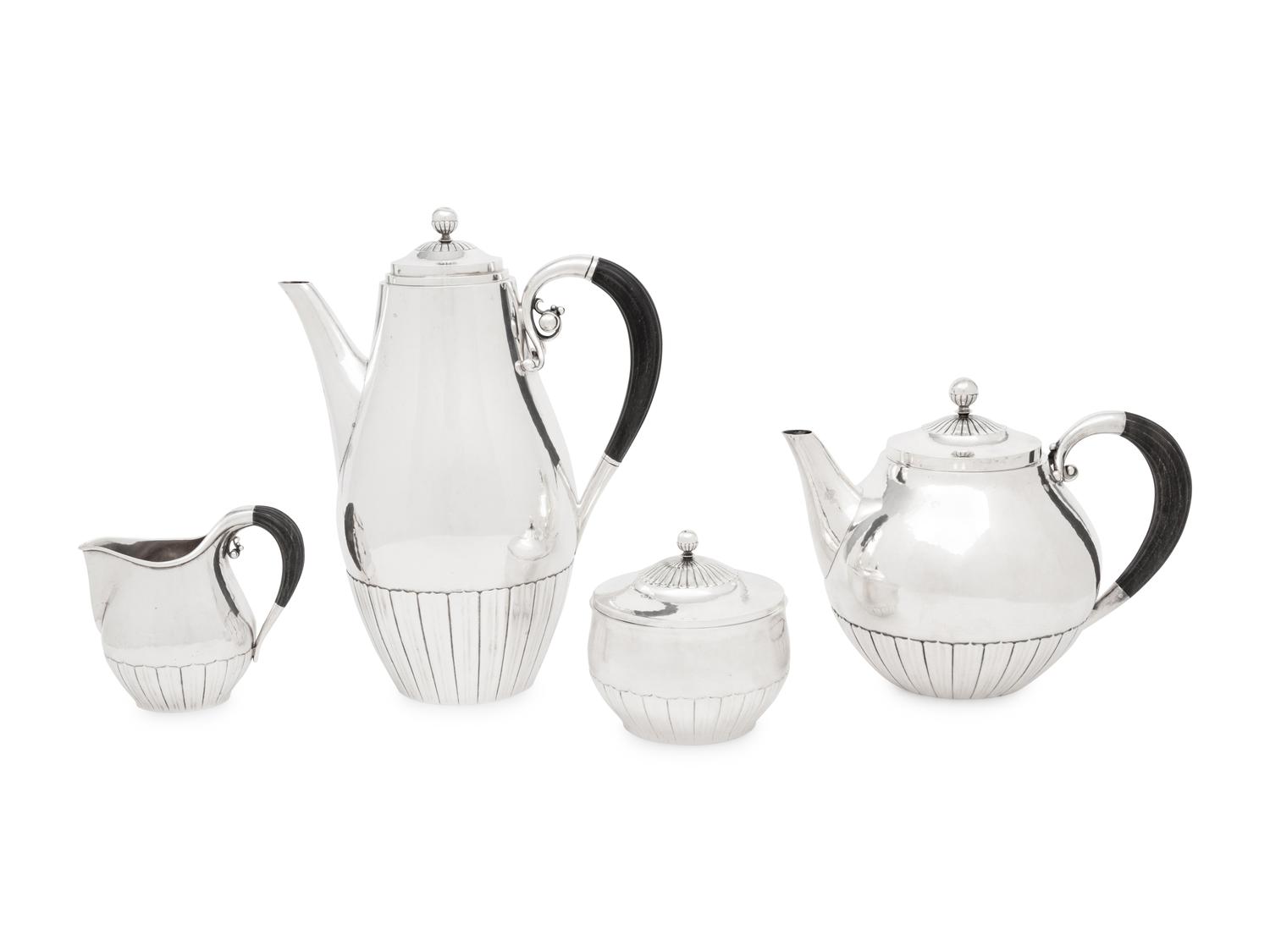 A Johan Rohde for Georg Jensen Cosmos Silver Four-Piece Tea Service