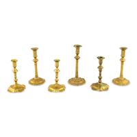A Collection of Six Brass Candlesticks