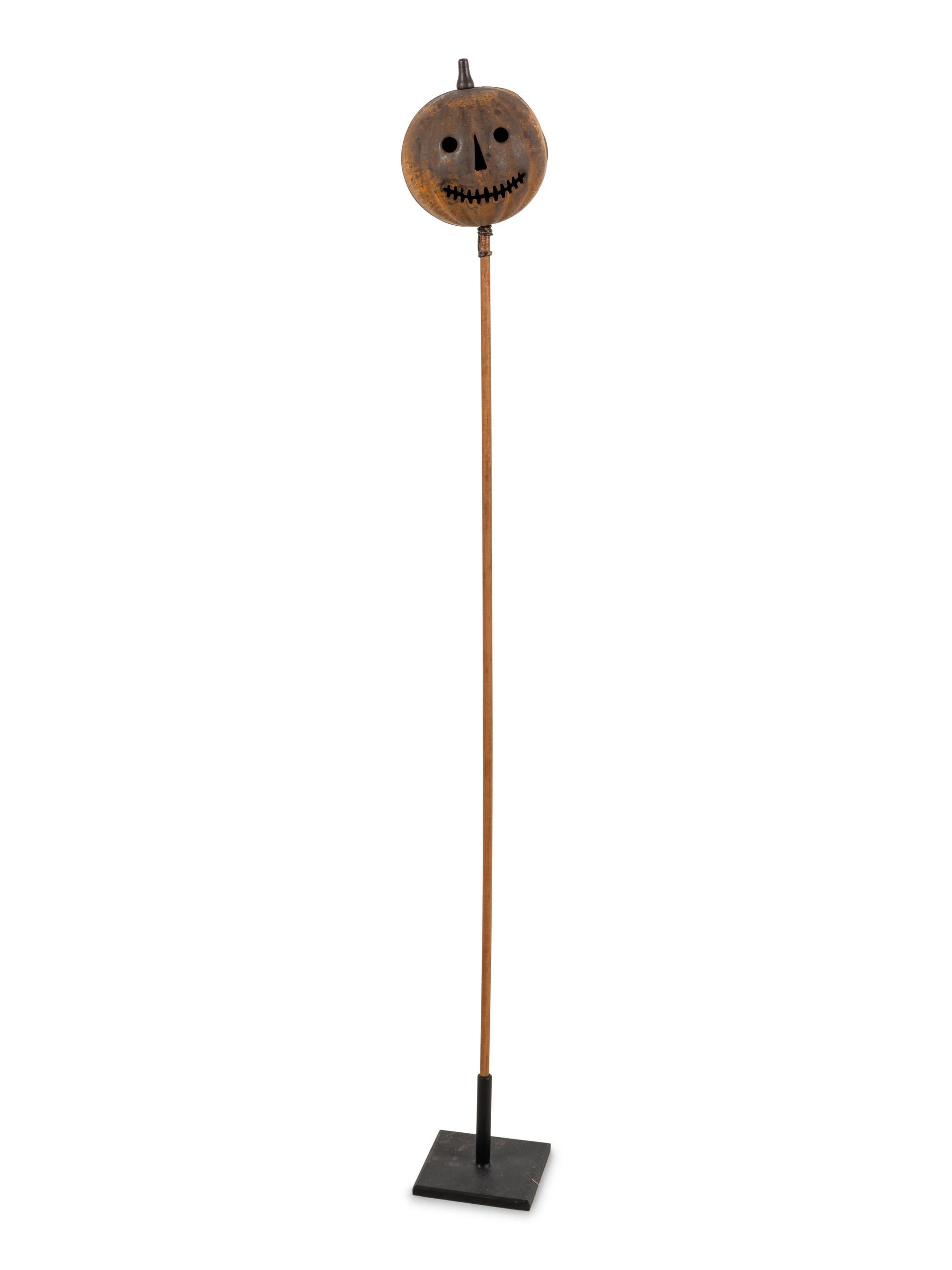 A Painted Tin Jack O' Lantern Ornament