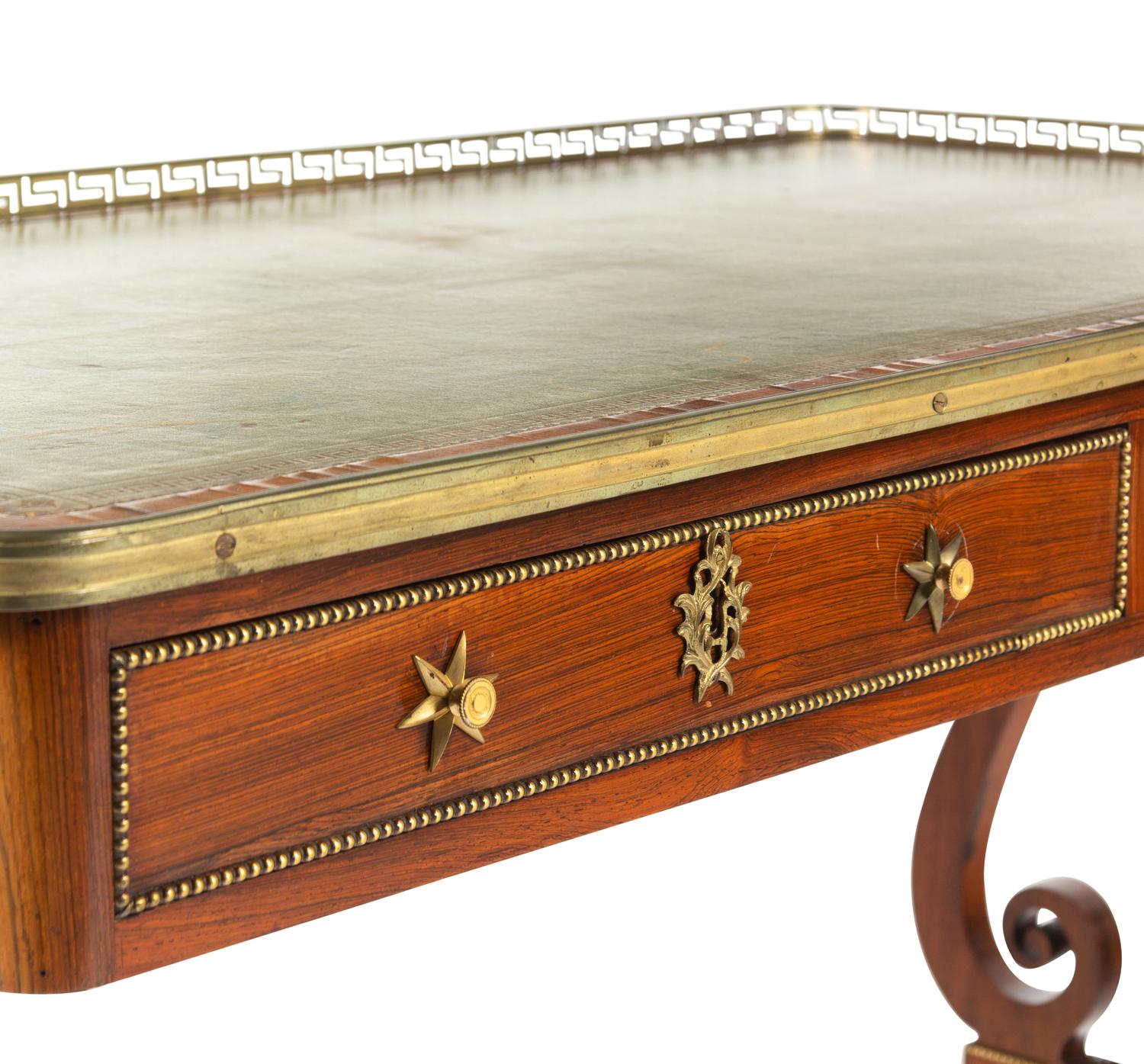 A Regency Brass Mounted Rosewood and Rosewood Grained Writing Table