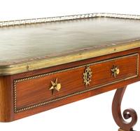 A Regency Brass Mounted Rosewood and Rosewood Grained Writing Table