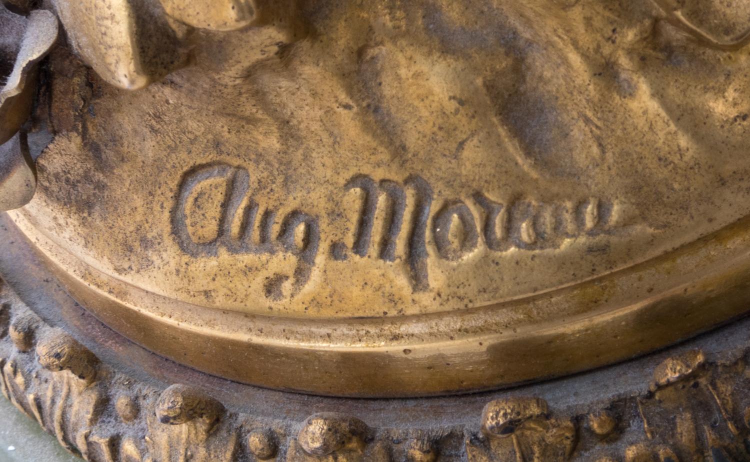 A French Onyx and Gilt Metal Clock Garniture