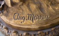 A French Onyx and Gilt Metal Clock Garniture