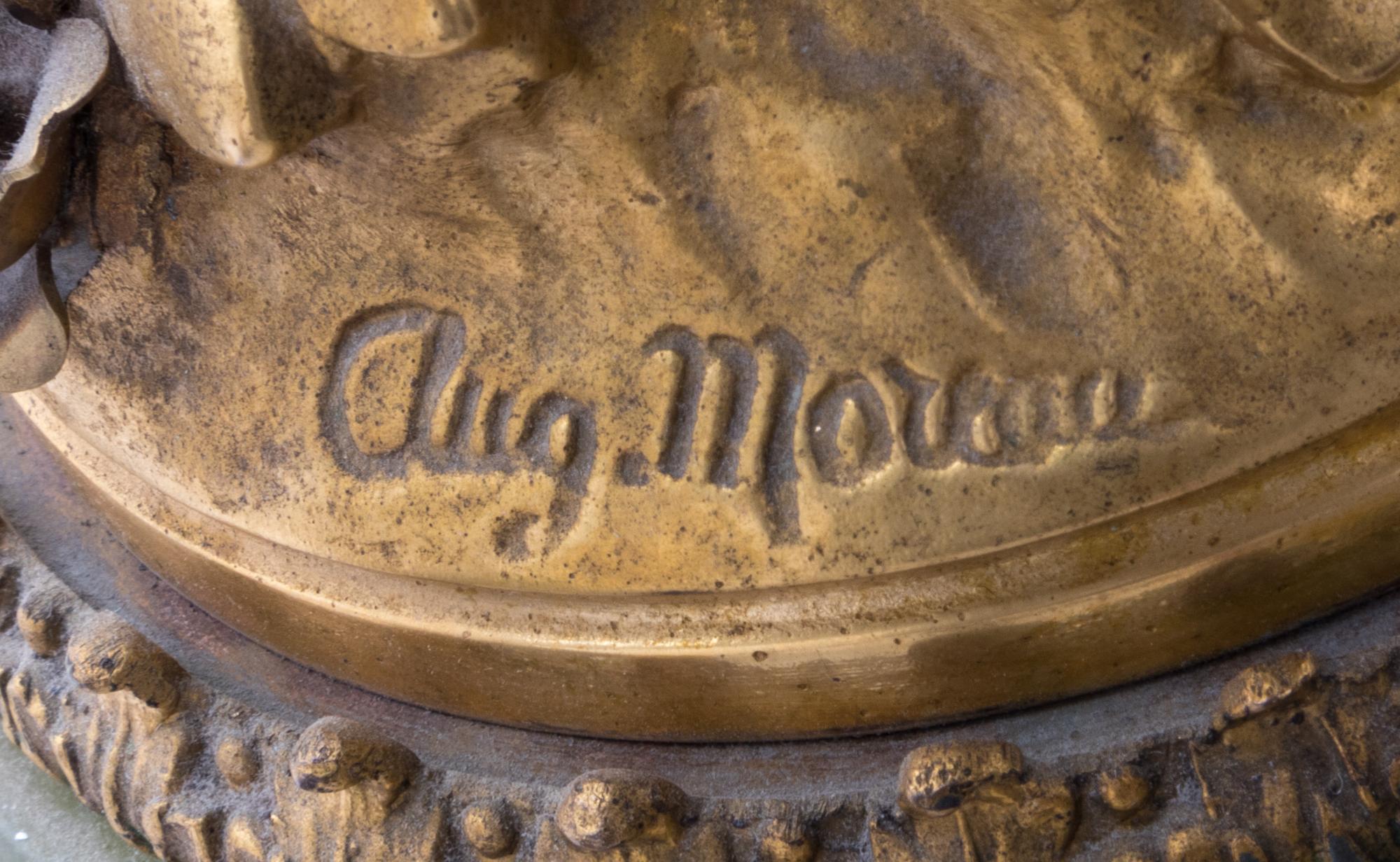 A French Onyx and Gilt Metal Clock Garniture