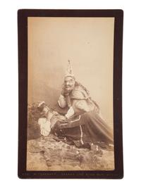 [NATIVE AMERICANS] DE GROFF, Edward, photog. 2 boudoir cards of a Haida shaman. Sitka, AK, ca 1890.