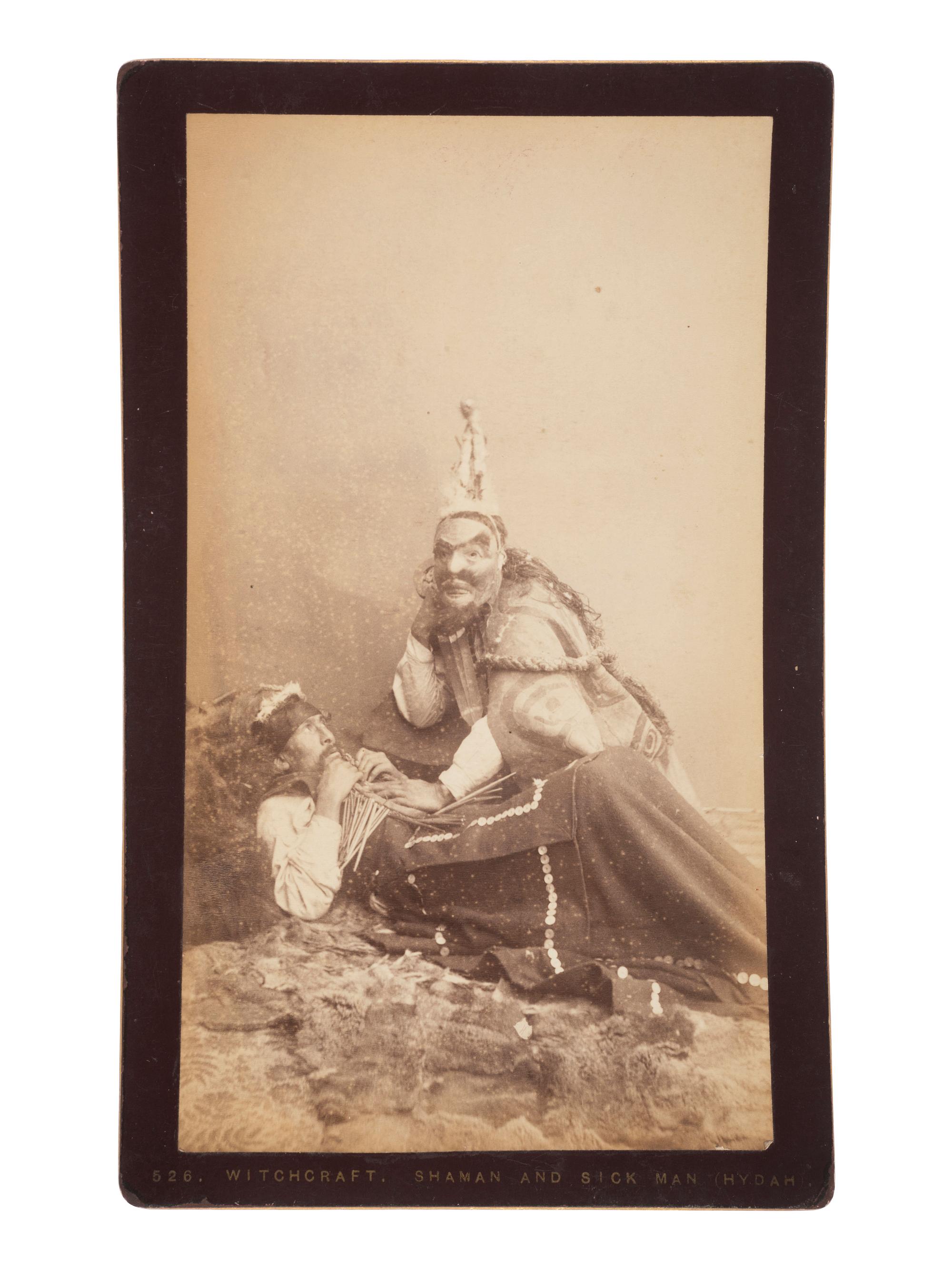 [NATIVE AMERICANS] DE GROFF, Edward, photog. 2 boudoir cards of a Haida shaman. Sitka, AK, ca 1890.