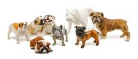 A Group of Seven Porcelain and Bisque Bulldogs Width of widest 8 1/4 inches.