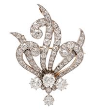 An Edwardian Platinum Topped Gold and Diamond Pendant/Brooch, T. B. Starr, 10.75 dwts.