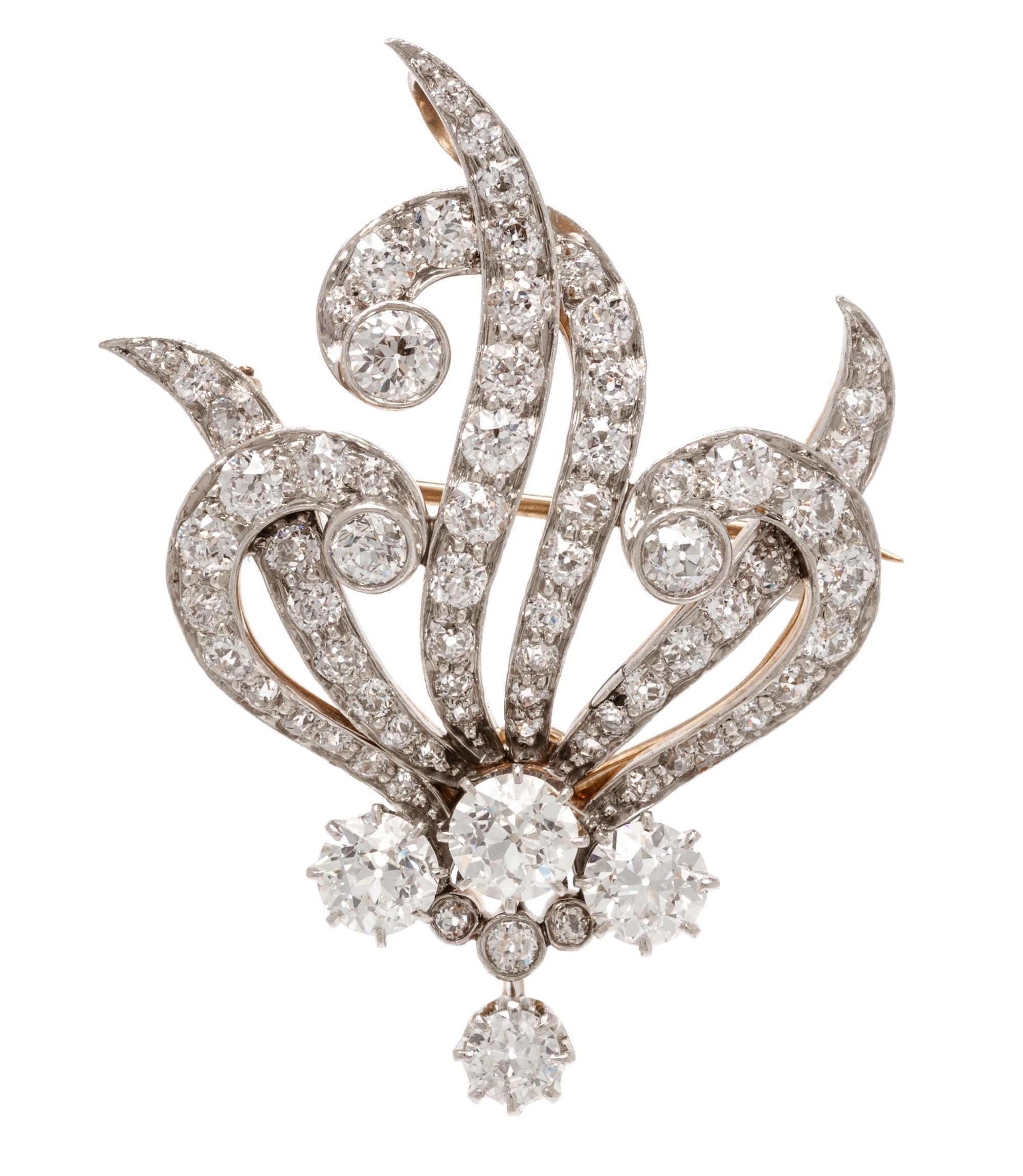 An Edwardian Platinum Topped Gold and Diamond Pendant/Brooch, T. B. Starr, 10.75 dwts.