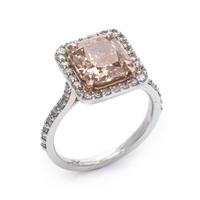 A 14 Karat White Gold, Fancy Brown-Orange Diamond and Diamond Ring,
