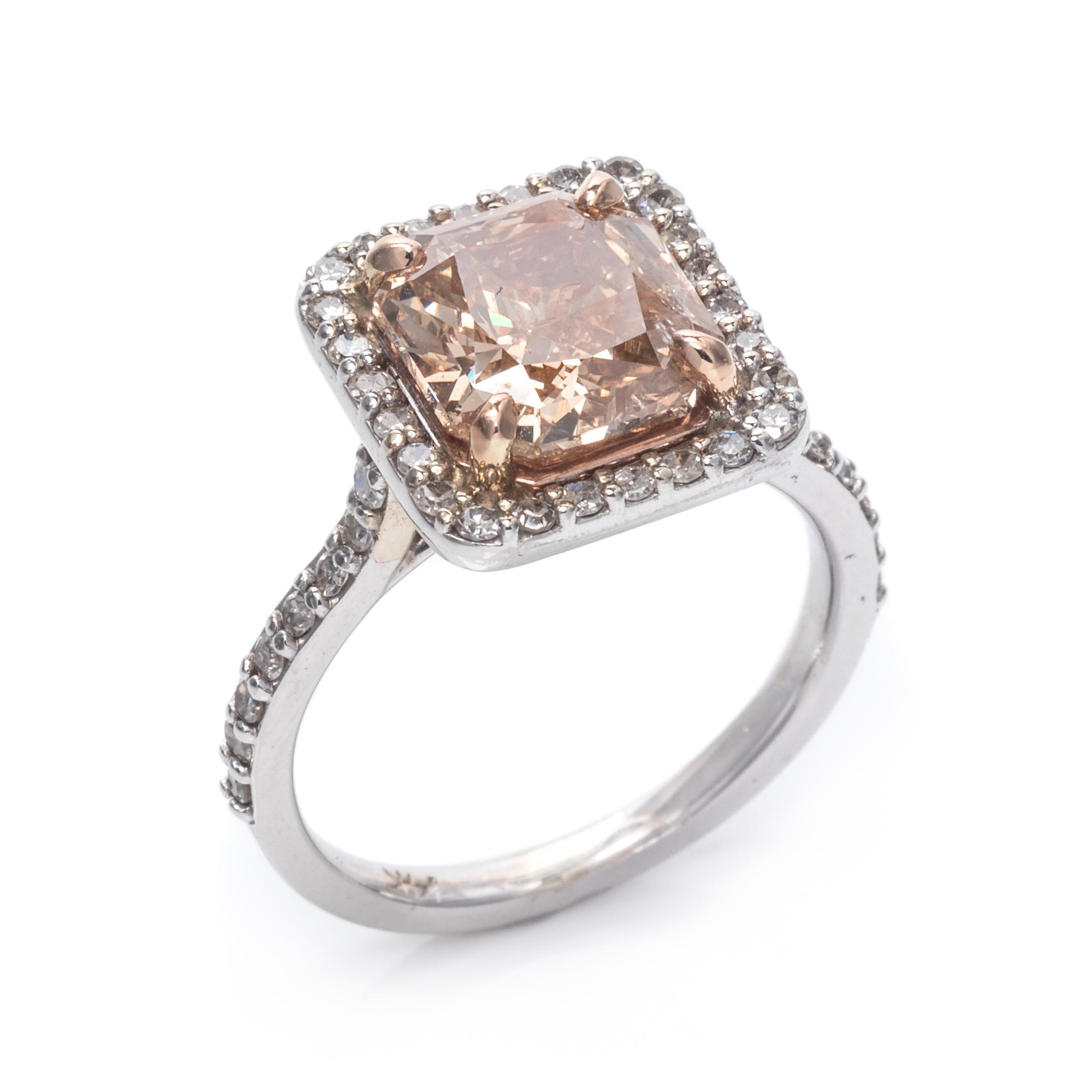 A 14 Karat White Gold, Fancy Brown-Orange Diamond and Diamond Ring,