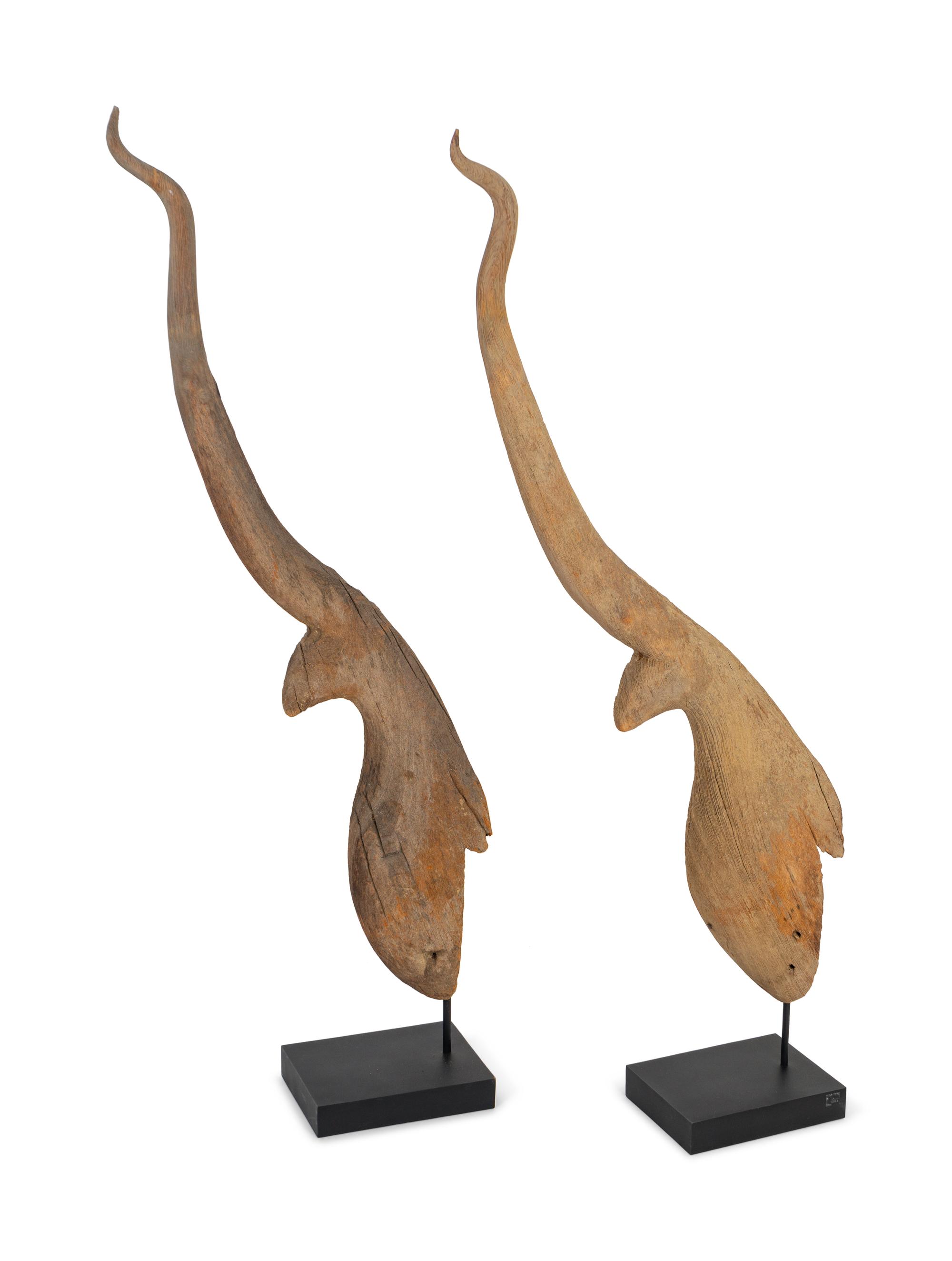 A Pair of Thai Weathered Teak Chofa Temple Finials — 18TH/19TH CENTURY