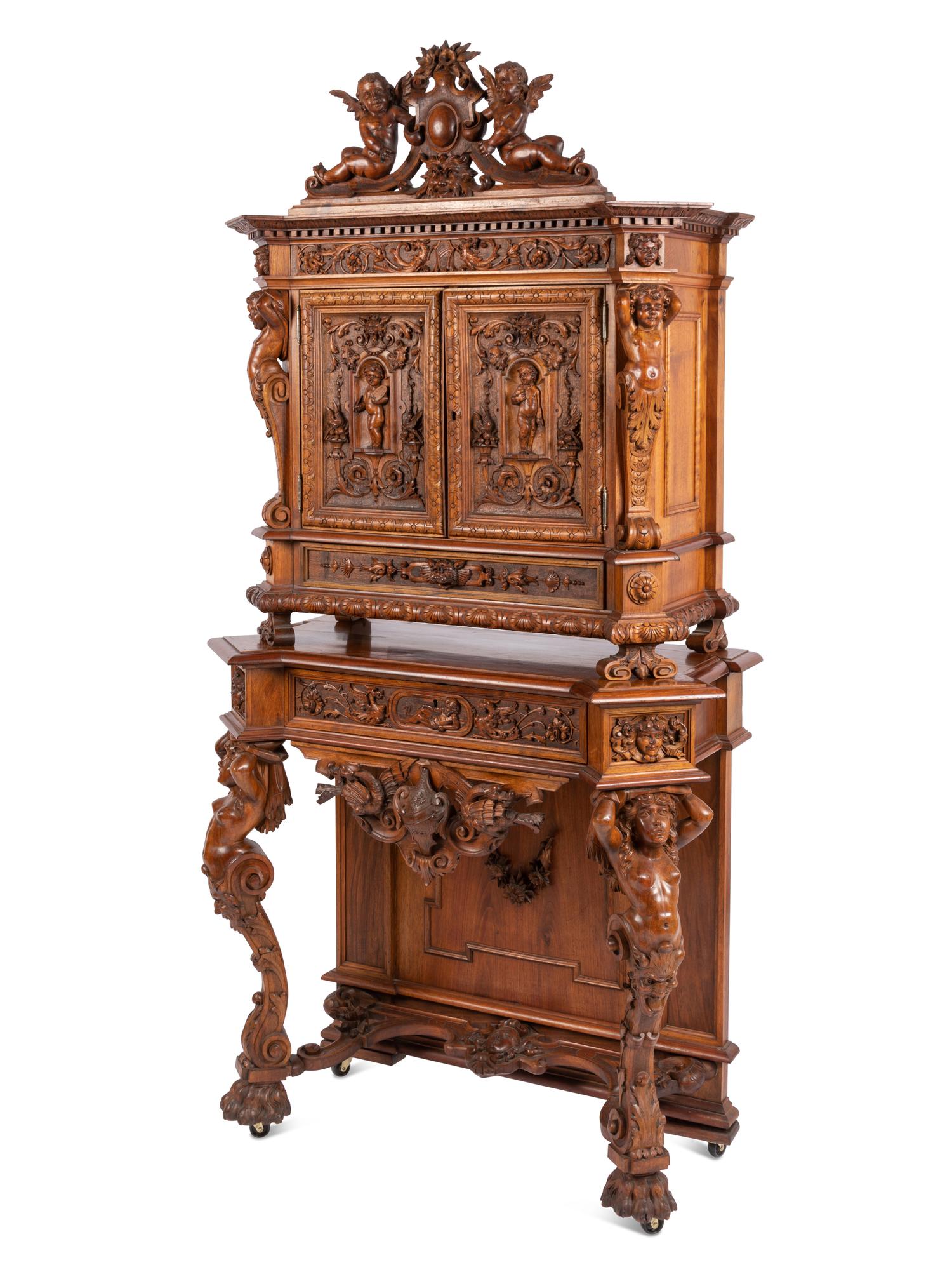 A Renaissance Revival Carved Walnut Cabinet In the Manner of Alexander Roux