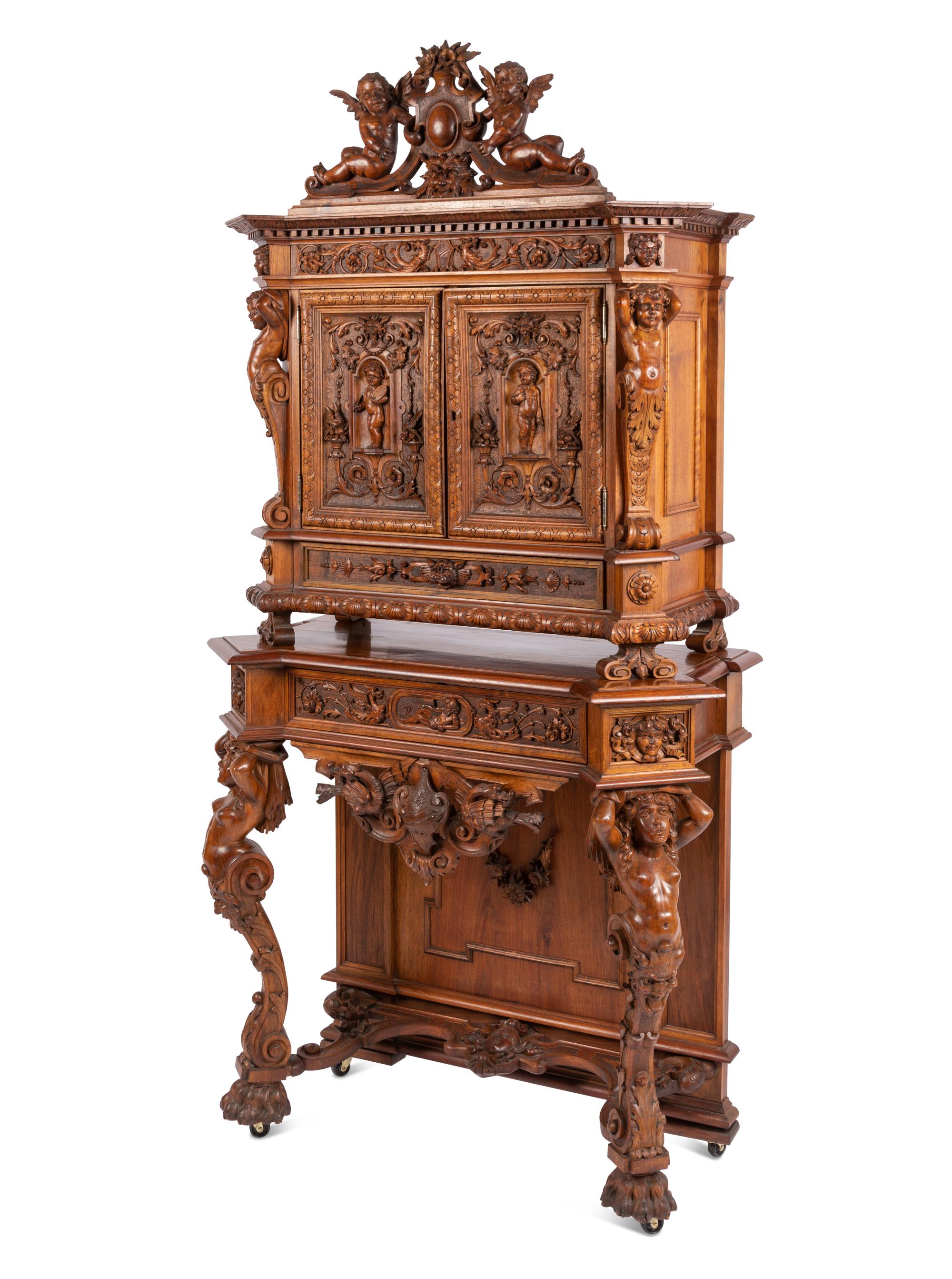 A Renaissance Revival Carved Walnut Cabinet In the Manner of Alexander Roux